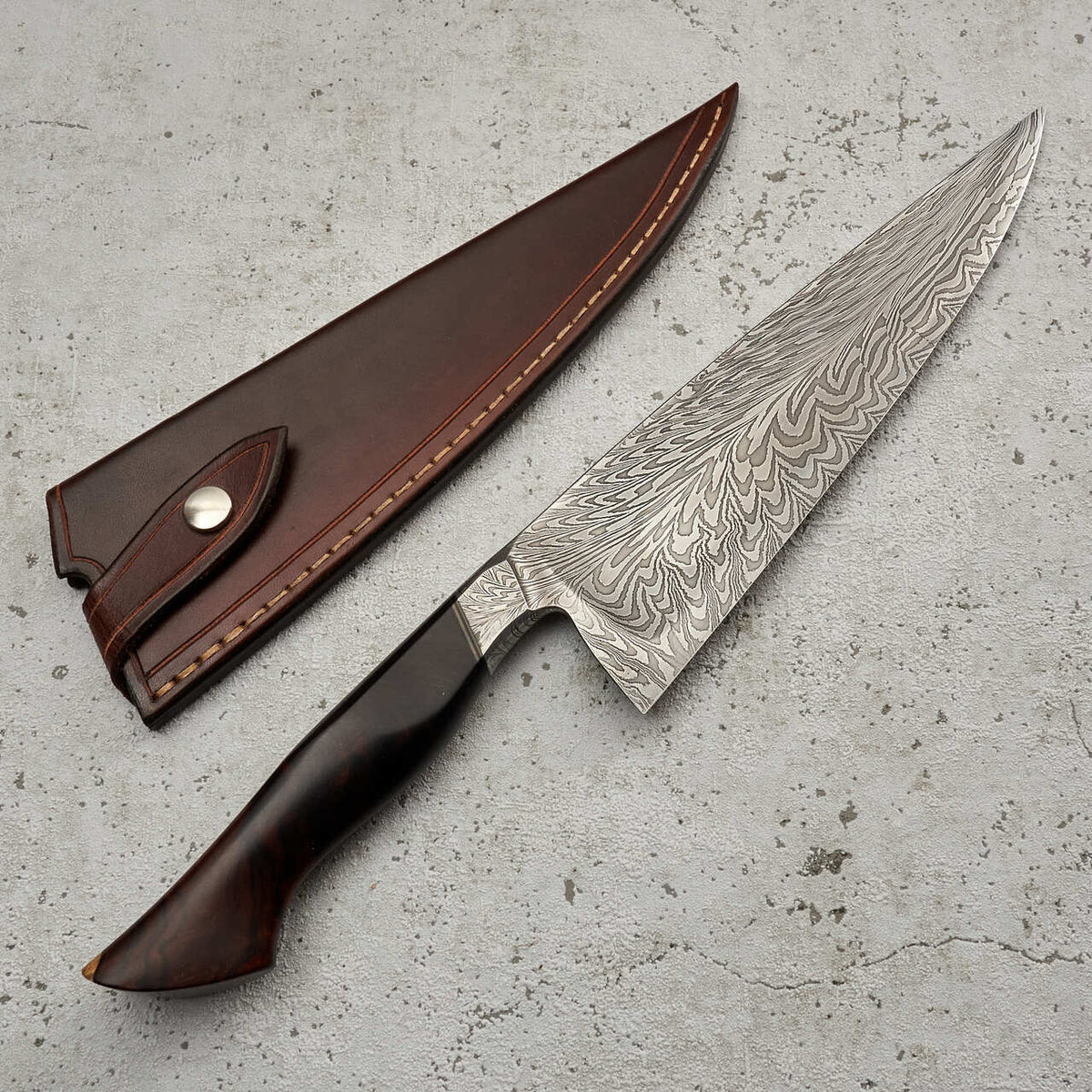 http://moderncooking.com/cdn/shop/products/Chef_Knife_220mm_Feather_Damascus_S_Grind_with_Integral_Ironwood_Handle_-_Blade_5__40725.1642320439.1280.1280_1200x1200.jpg?v=1647797925