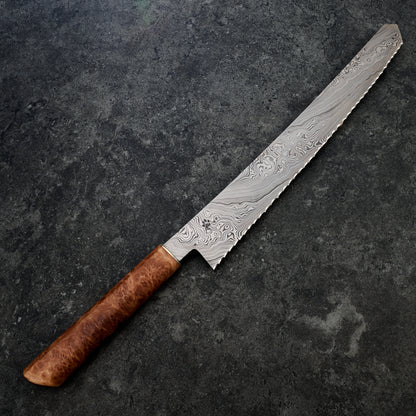 Bread Knife 280mm Damasteel DenseTwist, Eucalyptus Burl & Brass