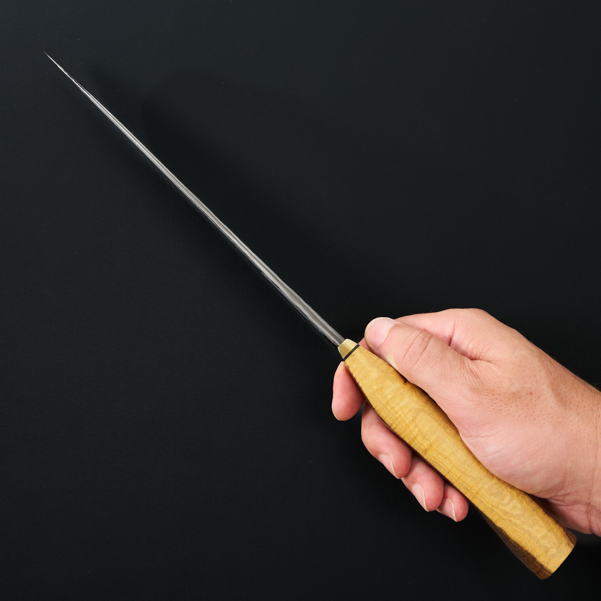 Two-tone Australian mulga handle and brass bolster on a Tobias Hangler chef knife