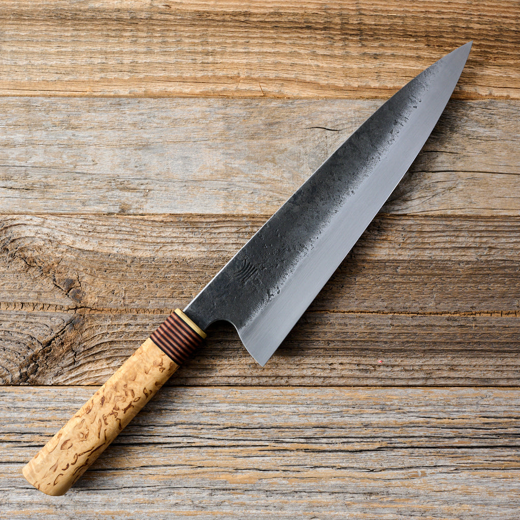 https://moderncooking.com/cdn/shop/files/Gyuto240mmWroughtIronClad135Cr3Kuroushi_a82269a8-7af7-4581-895a-d27bb2f15656_1024x1024.jpg?v=1695047307