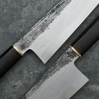 Black X Hado Gyuto 240mm SanMai, 135Cr3, Wrought Iron, Ebony and Brass – detail view