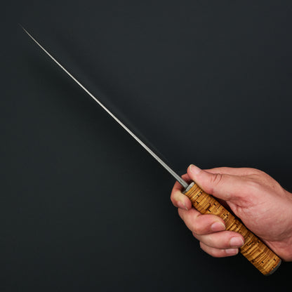Spine view showing the aggressive distal taper towards the gyuto’s fine tip
