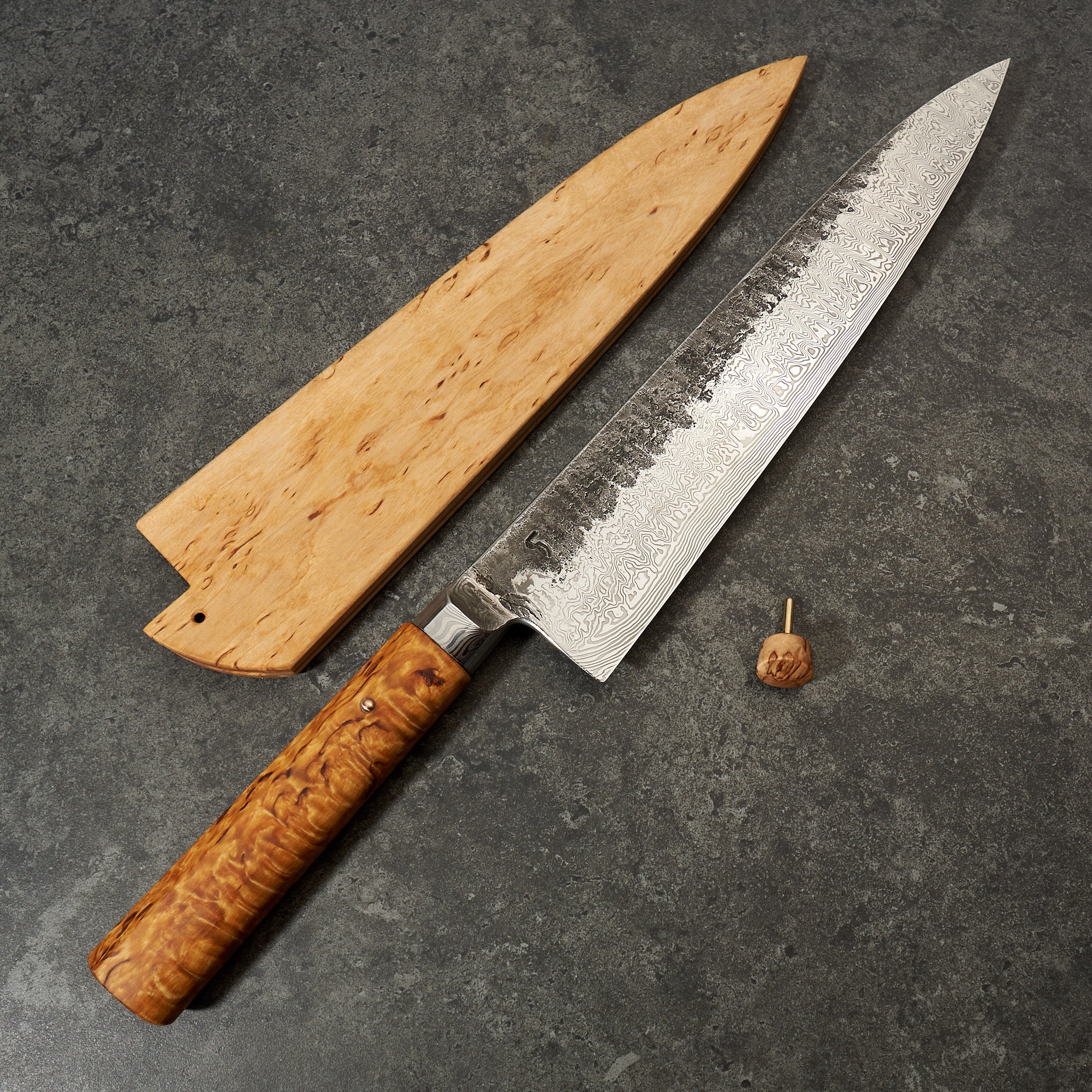 https://moderncooking.com/cdn/shop/products/Bocused_OrDamasteelGyuto250mmIntegral-Blade_Saya9.jpg?v=1648743368