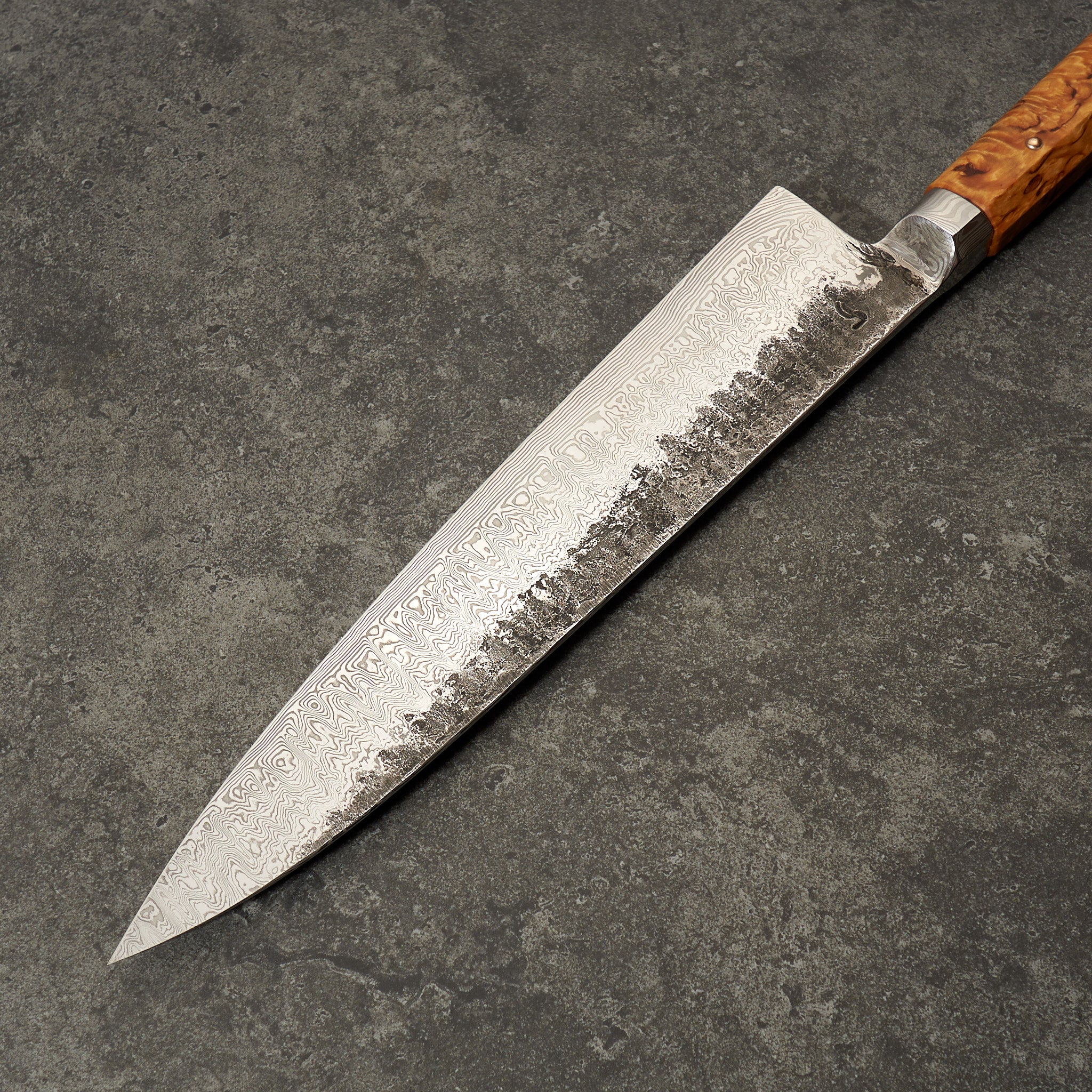 https://moderncooking.com/cdn/shop/products/Bocused_OrDamasteelGyuto250mmIntegral-Profile4.jpg?v=1648746740